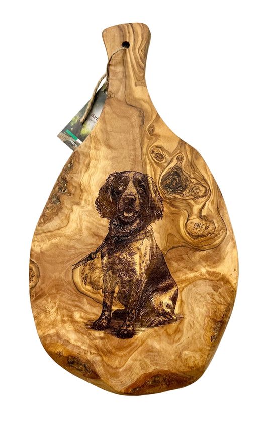 Wooden cutting board with a dog engraving on a white background