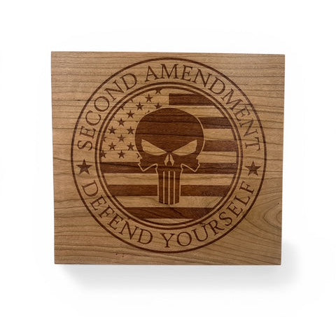 Wooden block with 'Second Amendment Defend Yourself' engraving featuring a skull and American flag design.